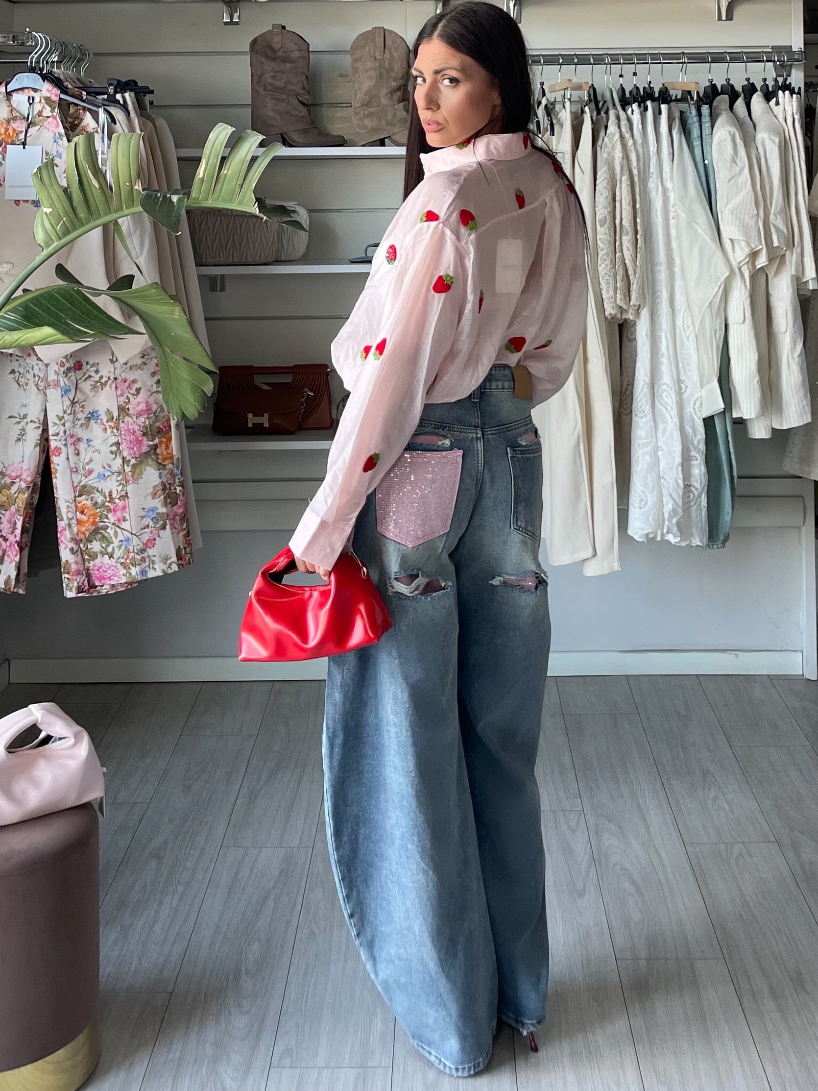 Jeans balloon chiaro con tasca glitter rosa